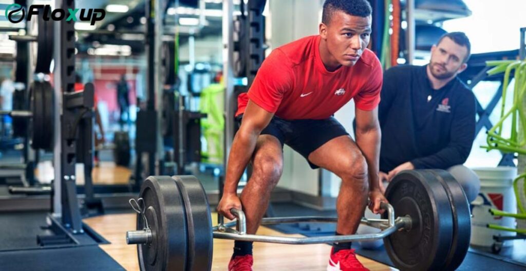 athlete training with coach measuring partnership success and performance progress in gym