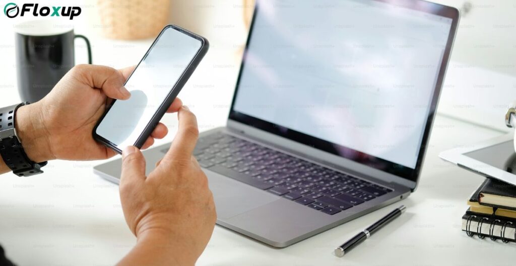 AI Gym Booking: Emerging trends in class booking software, showing a person using a smartphone and laptop to manage gym schedules efficiently.